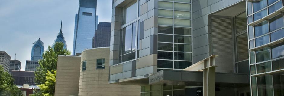 Exterior of Pavilon building and Philadelphia skyline at Community College of Philadelphia.