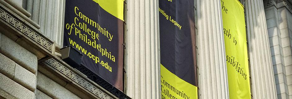 Banners hanging on Front of Mint Building with Community College of Philadelphia logo and www.ccp.edu.