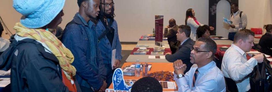 Transfer Fair - students talking to college rep from 4 year school