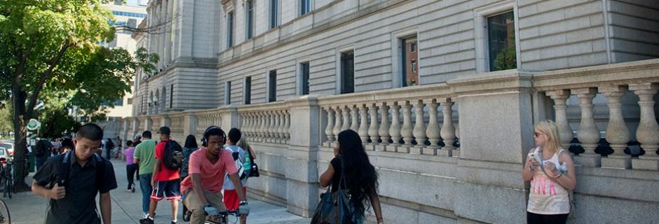 Students walking outside by the Mint Building at Community College of Philadelphia.