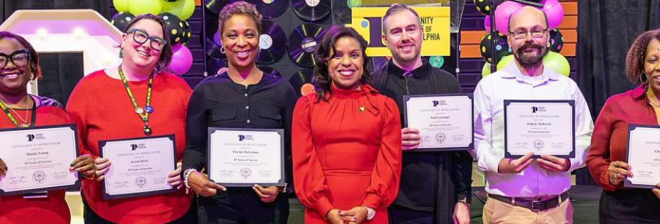 Dr. Marshall with employees accepting their years of service recognition