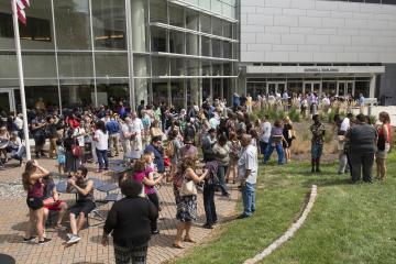 A crowd gathers in Bonnell Courtyard to view the eclipse.