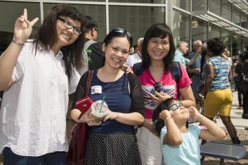 A group of eclipse viewers smiles for the camera.