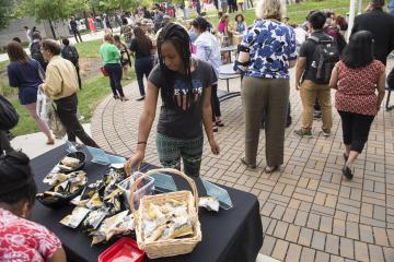 An Eclipse Party Goer helps herself to snacks.