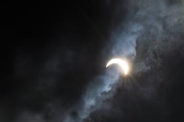 A view of the eclipse through the clouds.