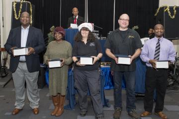 Faculty and staff with 20 years of service pose for the camera