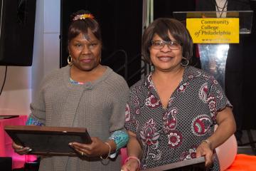 Two receive their certificates for 35 years of service.