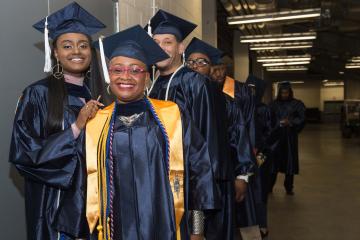 Graduates line up to march.