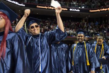 Graduates marching into the arena.