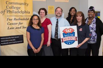 Group photo with event sign.