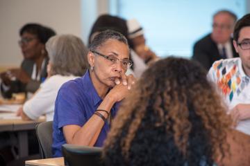 A person listens during group discussions.