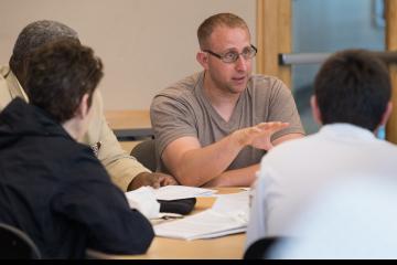 A participant speaks during group discussion.