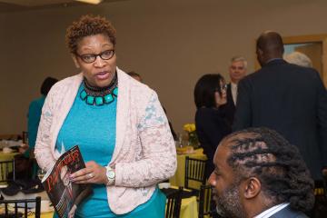 Pathways Magazine featured alum, Weena Beard chats at breakfast.