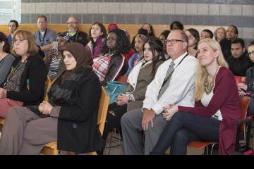 The audience smiles and enjoys the presentation.