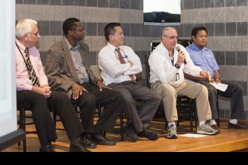 A panel member responds to the audience member's question.