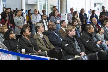 The audience listens to Dr. Generals.