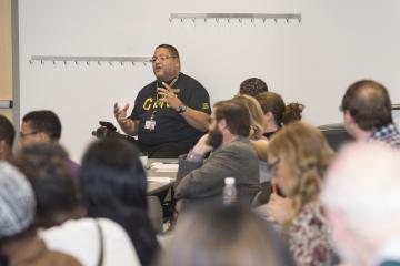 Student Body President, Troy Bundy, speaks to Amber Hikes and the audience.