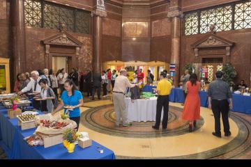 The crowd mingles and serves themselves lunch