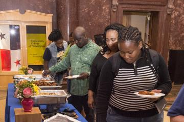 Attendees serve themselves lunch