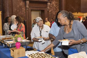 Attendees serve themselves lunch