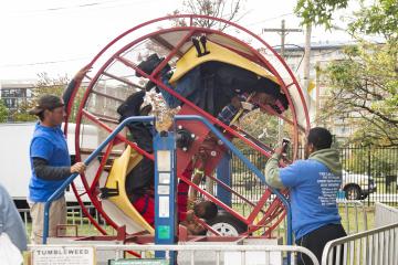 Riders start to spin in the "Tumbleweed" ride.