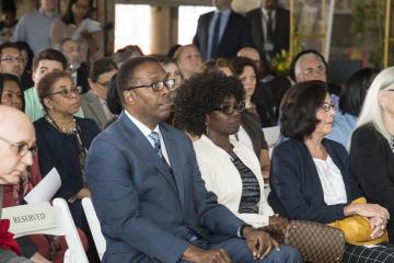 City Council President Darrell Clarke and Community College Foundation Member Ellyn Jo Waller listen to the president speak.