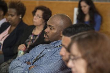 An audience member listens to Dr. Generals.