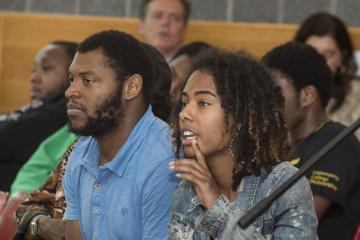 A young audience member asks Dr. Generals a question.