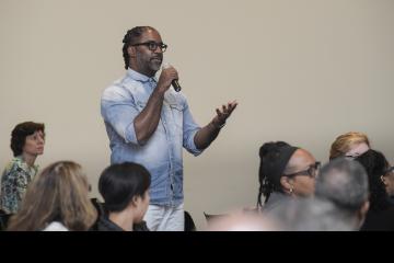 An attendee asks questions of the panel.