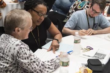 A team works on answer the first round of trivia questions.