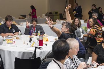 Trivia contest participants celebrate a winning answer.