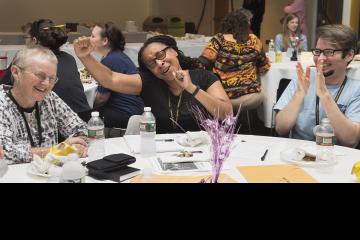 Trivia contest participants celebrate a winning answer.