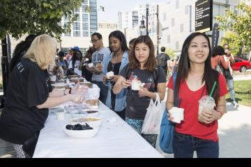 People line up to get their ice cream.