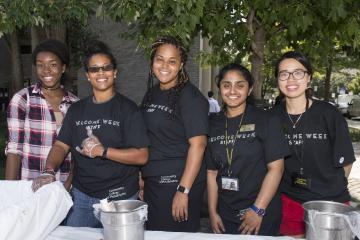 The Welcome Week staff pose after serving ice cream.