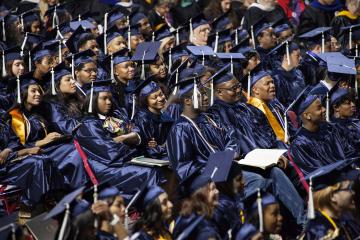 A crowd shot of the graduates listening to speeches.