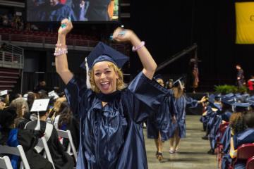 A graduate celebrates.