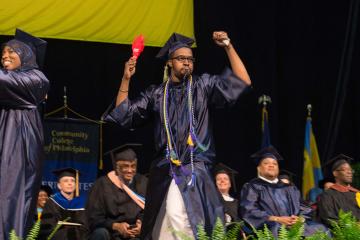 A graduate celebrates.