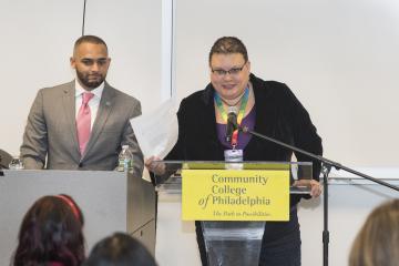 MC, Amy Birge, introduces speaker Dante Austin, Deputy Sheriff and LGBT Liaison.