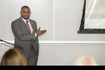 Dante Austin tells the audience about his coming out at the training academy.