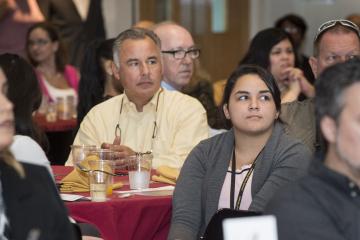 The audience listens to Ms. Borges Carrera.