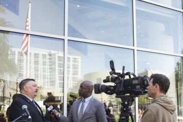 Stephen Bachovin speaks to the press after the ceremony.