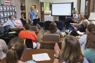 A faculty member gives her presentation.