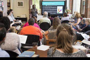 A faculty member gives her presentation