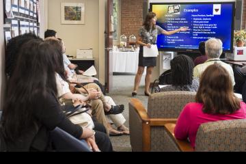 A faculty member gives her presentation