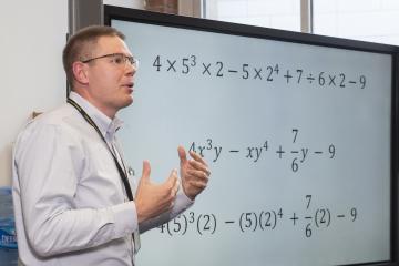 A faculty member gives his presentation.