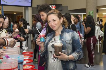 A student poses with her water ice.