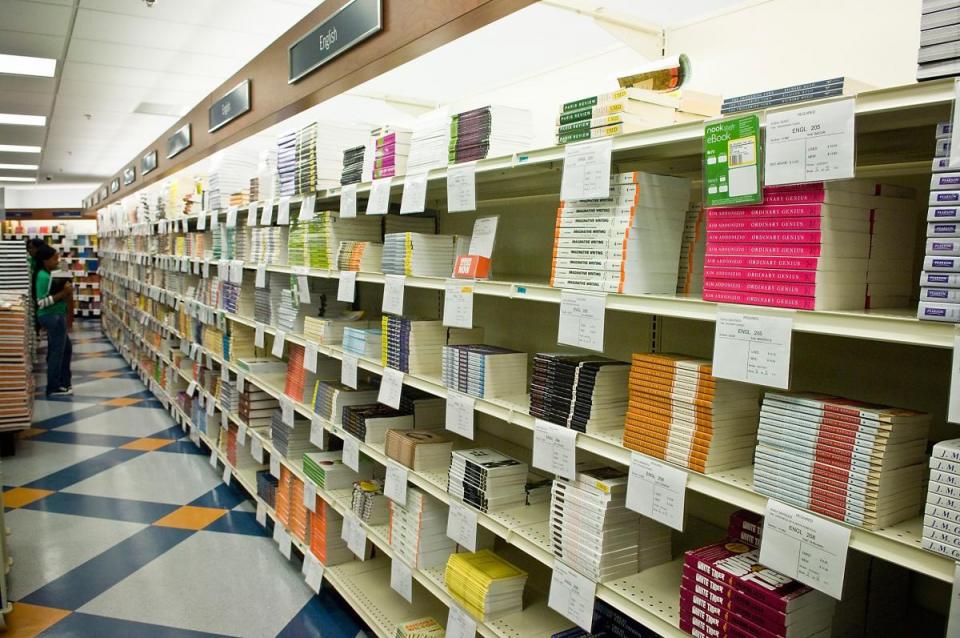 books lined up on shelves in bookstore