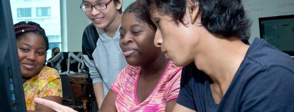 Students tutoring in the computer center